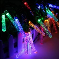 several different colored lights in the shape of tubes with wires attached to each tube, all lit up