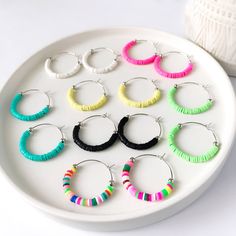 The adorable Harlow vinyl heishi bead hoop earrings are lightweight and comfortable to wear all day.  Add a splash of color to your day with these beaded hoops.  Perfect for Spring, Summer, or ANY time of the year!    Toss on a pair of these cute Harlow hoops with your favorite tee and cut-off denim shorts or dress them up for a night out with the girls!  They're perfect for everyday wear to the office or to school! Details: Harlow: Small partially beaded hoops measure 1 1/4 inches in diameter Diy Jewlry, Heishi Beads, Beaded Hoop Earrings, Beaded Hoops, Jewelry Earrings Hoops, Time Of The Year, Jewelry Ideas, Friendship Bracelets