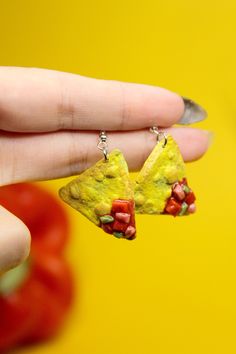 Embrace your love for Mexican food with these adorable salsa and chip dangle earrings. Handcrafted by skilled artisans, these unique pieces of artisan jewelry are designed to delight the foodie in you. Imagine the joy of dining out with friends, savoring your favorite dishes from your go-to restaurant (even if you've enjoyed them countless times before!). Food is more than just sustenance; it's about creating memories, forging connections, and sharing special moments around the dining table. We take pride in hand-making each earring personally, infusing them with care and attention to capture the essence of those joyful dining experiences. Our commitment to quality is unwavering, as we never outsource our products to cheap overseas factories. Feast your eyes on the vibrant and realistic ha Quirky Multicolor Dangle Jewelry, Quirky Handmade Drop Earrings, Quirky Multicolor Jewelry For Gifts, Quirky Dangle Jewelry For Gifts, Quirky Dangle Jewelry Gift, Fun Dangle Jewelry For Crafting, Quirky Dangle Jewelry As A Gift, Quirky Yellow Jewelry Gift, Quirky Yellow Jewelry For Gift