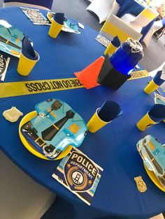 a blue table topped with yellow police tape