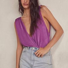 This Bodysuit By Intimately Free People Features A Billowy, Surplice-Wrap Bodice, Plunging V-Neckline, Femme Pleating Throughout, Exposed Back, A Fitted Bottom, And A Cheeky Bottom Coverage. Style: Night Owl Color: Juneberry Size: Xl Same Or Next Day Shipping Chic Purple Bodysuit For Spring, Chic Stretch Purple Bodysuit, Chic Sleeveless Purple Bodysuit, Chic Purple Stretch Bodysuit, Chic Purple Tops For Loungewear, Purple V-neck Top For Night Out, Purple Summer Tops For Date Night, Purple Tops For Summer Date Night, Purple Tops For Date Night In Summer