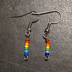 waterproof glass beaded minimalistic pride earrings Adjustable Jewelry For Pride Festival Gift, Rainbow Nickel-free Drop Earrings, Nickel-free Rainbow Drop Earrings, Minimalist Glass Dangle Jewelry, Rainbow Dangle Earrings For Everyday, Minimalist Glass Jewelry With Ear Wire, Rainbow Adjustable Minimalist Jewelry, Hypoallergenic Rainbow Drop Earrings, Minimalist Adjustable Rainbow Jewelry