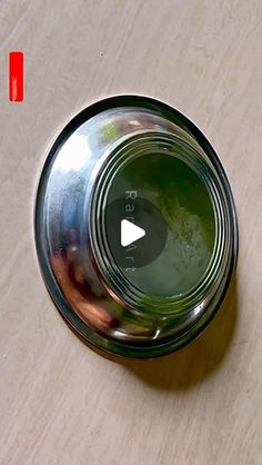 an empty glass jar sitting on top of a wooden table