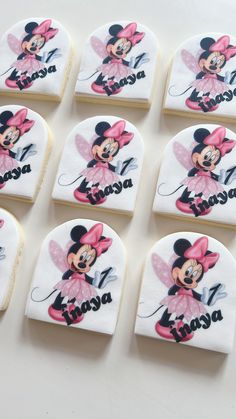 six decorated cookies with minnie mouse on them