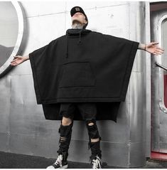 Stand out in style with this men's mid length avant garde goth bat wing sleeve hooded jacket. perfect for adding a unique touch to any outfit, this jacket is a must-have for any alternative look. shop now for fast, free shipping! Oversized Hoodie For Halloween, Oversized Hoodie Outerwear For Halloween, Gothic Hooded Winter Cape, Black Long Sleeve Cape For Halloween, Oversized Black Gothic Outerwear, Cyberpunk Black Hooded Jacket For Fall, Black Cyberpunk Hooded Jacket For Fall, Black Gothic Cape Outerwear, Oversized Black Outerwear For Halloween