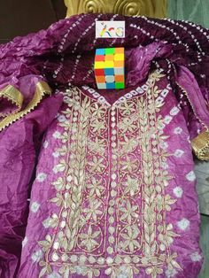 Thank you very much for visiting my shop. New Launched heavy suits pcs Bandhej silk suits with heavy hand goota Patti nd Kundan work with gotta bijjya border on duppta with same fabric silk bottom  Note: Duppta also with gotta Patti work 03 pcs suits Kurta 2.5 mitrs Duppta 2.5 mitrs Bottom 2.5 mitrs Easy to wear and very comfortable                                                    FREE STITCHING OFFER It Gracefully Add Style To Your Attire & Match With Your Confidence Disclaimer: Colors may sl Bollywood Style Raw Silk Sets With Dabka Work, Bollywood Style Dabka Work Sets In Raw Silk, Purple Raw Silk Salwar Kameez For Festivals, Festival Purple Raw Silk Salwar Kameez, Katan Silk Kurta With Dabka Work For Festivals, Semi-stitched Dola Silk Sets With Zari Work, Bollywood Style Sets With Dori Work In Chinon, Eid Chanderi Unstitched Suit With Gota Work, Katan Silk Unstitched Saree Suit With Gota Work