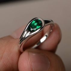 This is a gorgeous handmade creation. Its beauty is its simplicity & Elegance. The 5*7 mm oval shape faceted lab emerald is crafted in solid sterling silver and with rhodium plated. All item is sent in a beautiful gift box If you have any idea of design your ring,pls contact me directly. You can realize more lovely stuff clicking the link https://www.etsy.com/shop/knightjewelry?refshopsection_shophome_leftnav Please leave the correct address and you phone number for delivering successfully. Emerald Oval Cabochon Ring As A Gift, Oval Faceted Birthstone Ring For Anniversary, Oval Faceted Crystal Promise Ring, Oval Emerald Ring For Gift, Oval Emerald Ring As A Gift, Elegant Oval Faceted Emerald Ring, Oval Emerald Ring With Polished Finish, Emerald Promise Ring With Polished Finish For May Birthstone, Teardrop Emerald Ring As Gift