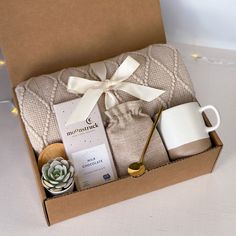 an open box containing coffee, tea and other items