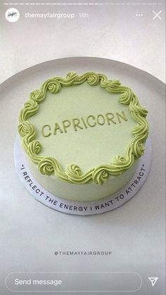 there is a cake with the word capricorn on it sitting on a plate