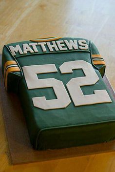 a cake made to look like a green bay football jersey with the number 52 on it