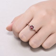 This is 5mm round cut natural garnet engagement ring rose gold. The accent stones are VVS man made cz diamond. The stones can be replace with other gemstones.For example,if you don't like the CZ accent,you can ask me replace it with tourmaline,aquamarine,diamond,emerald,sapphire... For custom making jewelry,it can be made in 2 different metal(Please contact me if you need this one made in solid gold). 1,Solid gold,including 14/18k white/rose/yellow gold. 2,925 sterling silver with white/yellow/r Rose Gold Birthstone Ring For Proposal, Rose Gold Ring With Lab-created Ruby, Garnet Diamond Ring For Anniversary, Rose Gold Ruby Promise Ring With Rose Cut Diamonds, Rose Gold Round Cut Ruby Promise Ring, Rose Gold Birthstone Ring With Rose Cut Diamonds, Rose Gold Ruby Ring With Brilliant Cut For Promise, Rose Gold Ruby Promise Ring Brilliant Cut, Garnet Ruby Ring For Promise