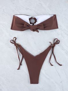 Indulge in timeless elegance with our strapless bikini, exuding sophistication and allure. Crafted from high-quality materials, this exquisite swimwear ensemble boasts a sleek and minimalist design, perfect for making a statement by the poolside or on the beach. The strapless top offers a flattering fit, while the bottoms accentuate your curves, enhancing your natural beauty with every wear. Elevate your swimwear collection with this must-have piece that seamlessly blends comfort, style, and sen Brown Strapless Swimwear For Summer, Elegant Brown Swimwear, Brown Strapless Beachwear Swimwear, Brown Swimwear With Built-in Bra For Beach Season, Brown Summer Swimwear With Built-in Bra, Strapless Swimwear, Printed Ties, Swimwear Collection, Strapless Top