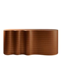 an oval wooden table with wavy lines on it