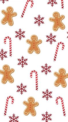 gingerbreads and candy canes on a white background with red snowflakes