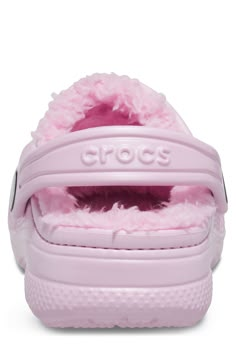 Cozy faux shearling lines the footbed of this comfortable clog your little one will love. Slip-on Faux shearling lining Round toe Slingback EVA upper and sole/polyester faux shearling lining Imported Pink Fluffy Crocs, Pink Crocs With Fur, Dollette Shoes, Fur Lined Crocs, Crocs With Fur, Lined Crocs, Crocs Baya, Classic Crocs, Bday Wishlist