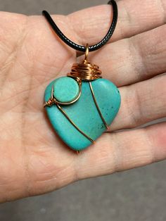 "This turquoise wire wrapped heart pendant necklace is handmade. This listing is for one heart necklace with your choice of black or brown cording. Not only is this a unique necklace but with two different looks it is also a great value. I use semi precious turquoise stones and copper wire to create this unique pendant. This turquoise heart stone measures approximately 1.25\" by 1.125\"prior to wrapping. The pendant measures 1.65\" in height after wrapping. The necklace cord measures 2mm in diameter. The pendant is removable and can be changed to another necklace if desired. At checkout , you can customize the necklace length from 16-20 inches. This necklace cord is finished with stainless steel lobster claw clasp and findings. However, the pendant will be wrapped using copper wire as seen Turquoise Copper Wire Necklace For Gift, Heart-shaped Wire Wrapped Necklace For Gift, Handmade Heart-shaped Copper Necklaces, Valentine's Day Heart-shaped Wire Wrapped Necklace, Wire Wrapped Heart, Cute Anklets, Unique Wire-wrapped Turquoise Pendant Necklace, Pendants Necklace, Necklace Cord