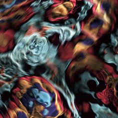 an abstract image of red, yellow and blue flowers