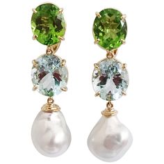 18kt Yellow Gold Elegant Three Stone Drop Earrings with faceted Peridot Aquamarine and South Sea Pearl. They are stamped A. Clunn. The Earrings measure 2 1/4 in length. The earrings can be made for Clip Earring or Pierced Earrings. They can also be custom made with any color stone combination. Please contact me with any inquiries you may have. Best, Christina Stone Drop Earrings, Big Hoop Earrings, Precious Jewels, Pink Topaz, Sea Pearl, Sea Pearls, South Sea Pearls, Drop Earring, Gold Drop Earrings