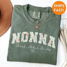 Comfort Colors® Nonna T-shirt, Nonna Shirt, Nonna gifts, Nonna Sweatshirt, Nonna Tshirt, Nonna Christmas Gift, New Grandma Shirt, New Nanna   About this t shirt: - Pre-shrunk cotton for size retention! - 100% US cotton that is ethically grown - Relaxed fit - Comfortable & cozy fabric Sizing details:  - We offer unisex sizing for all tees & sweatshirts. - Our Sweatshirts run about 1 size larger than typical women's sizing. - We carry several brands. Brand will vary based on color, size and availability. - Please check the size chart in the listing photos   Shipping & Processing: - Processing Time: Average of 1-3 business days - Shipping time: Calculated at checkout - Free domestic shipping to the mainland USA states   Returns, Exchanges, & Cancellations - Due to the timely manner we produce Graphic Tee T-shirt As Gift In Green, Personalized Crew Neck T-shirt For Mother's Day, Green Letter Print Top As A Gift, Personalized Relaxed Fit T-shirt As Gift, Green Letter Print Top As Gift, Green T-shirt With Letter Print For Mother's Day, Green Graphic Tee For Mother's Day, Custom Print Green Tops For Gifts, Green Custom Print Top For Gift