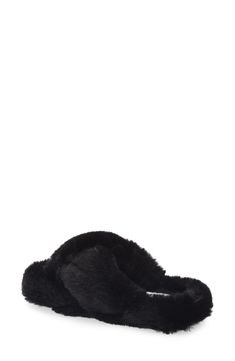 Plush faux fur straps and a footbed envelop your feet in comfort, allowing you to lounge in style. Polyester faux fur upper and lining/rubber sole Imported Comfortable Black Slippers With Faux Fur Lining, Black Plush Lined Winter Slippers, Black Casual Slippers With Faux Fur Lining, Fluffy Faux Fur Slippers For Winter, Casual Faux Fur Slippers With Plush Lining, Winter Slippers With Plush Lining And Faux Fur, Black Synthetic Slippers With Faux Fur Lining, Black Slippers With Faux Fur Lining, Black Fluffy Slippers For Winter