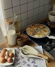 pancakes and eggs are sitting on the kitchen counter