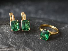 Gold Square Emerald Earrings set with a Created Emerald in an emerald cut, flawless clarity & deep green color, at 10x8mm each (6 Ct a pair).Gold Vermeil: 18k Gold over Solid 925 Sterling Silver ☞ made to last.Click here for ☞ Matching PendantClick here for ☞ Matching RingDetails:• Created Emerald in a flawless clarity• Emerald: 10x8mm, 6 Ct a pair, emerald cut• Lever Back Closure - "English Lock"• Dimensions: Length 15mm, Width 8m• 18k Gold VermeilSKU 1059 Gold Square Earrings, Gold Emerald Earrings, Emerald Studs, Green Diamond Rings, Deep Green Color, Green Emerald Ring, Emerald Ring Gold, Earrings Design, Matching Ring