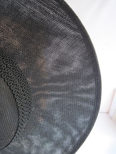 "* This black Sinamay hat form has a 12\" diameter and has a subtle and sophisticated animal print enhanced with the spectator feathered butterflies. The band is a woven braid and coordinates with the subdued hat print. * The hat has been designed to sit on either side of the head with an acrylic headband. * Upon ordering this is the exact hat you will receive. * Perfect to wear to any Special Event or Celebration, Ladies Luncheon, Derby Parties, Weddings, Wedding or Baby Shower, Anniversary, Fa Black Boater Hat With Curved Brim For Church, Black Curved Brim Boater Hat For Church, Elegant Sun Hat With Curved Brim And Woven Detail, Black Brimmed Boater Hat For Church, Elegant Woven Sun Hat With Curved Brim, Elegant Sun Hat With Curved Brim, Black Wide Brim Boater Hat For Church, Elegant Woven Brimmed Boater Hat, Black Curved Brim Fascinator For Beach