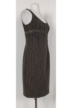 This classic tweed dress is instantly elevated with metallic silver threads and a feather trim at the waist. Perfect for day or night, this dress is a unique choice for any occasion. Size 6 Wool, polyester & nylon blend Concealed back zipper Above knee Back slit Fully lined Rounded neckline Sleeveless Silver metallic threads on fabric Feather trim at waist Empire waist Bust 32" Waist 30" Shoulder to hem 37.25" Fabric Feather, Fabric Feathers, Carmen Marc Valvo, Brown Tweed, Feather Trim, Tweed Dress, Casual Sweaters, Fashion Street, Above Knee