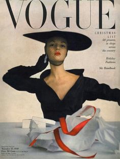 an old fashion magazine cover with a woman wearing a black hat