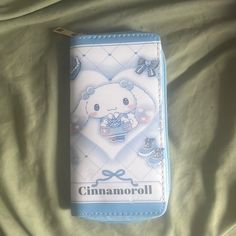 a small wallet with an image of a teddy bear on it