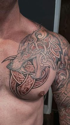 a man with a wolf tattoo on his chest