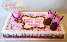 a birthday cake decorated with pink and brown icing, cowboy boots, and can't wait for you