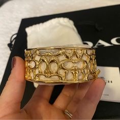 Coach Gold Signature Bracelet New With Tags And Dust Bag Chic Coach Bracelet, Coach Metal Bracelet Jewelry, Chic Gold Coach Bracelet, Coach Gold Bangle Bracelet, Coach Gold Heart-shaped Jewelry, Coach Jewelry, Signature Bracelet, Sophomore Year, Girly Jewelry