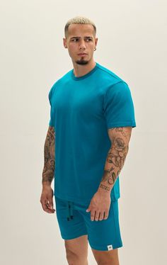 The Lightweight Cotton T-shirt offers the perfect blend of comfort, style, and versatility. Crafted from high-quality cotton fabric, this t-shirt is exceptionally soft and breathable, making it ideal for everyday wear. Its lightweight construction ensures that you stay cool and comfortable throughout the day, whether you're running errands, hitting the gym, or lounging at home. The cotton material is gentle on the skin and helps wick away moisture, keeping you feeling fresh and dry in any situat Light Blue Athleisure Top For Streetwear, Light Blue Sporty T-shirt With Relaxed Fit, Sporty Light Blue T-shirt With Relaxed Fit, Solid Color Cotton T-shirt For Athleisure, Solid Cotton Athleisure T-shirt, Blue Relaxed Fit Athleisure Top, Blue Cotton T-shirt With Relaxed Fit, Blue Cotton T-shirt Relaxed Fit, Blue Relaxed Fit Cotton T-shirt