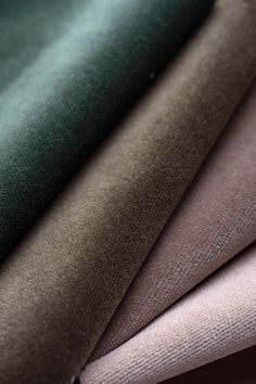 several different colors of fabric sitting next to each other