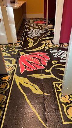 the floor has been painted with colorful designs