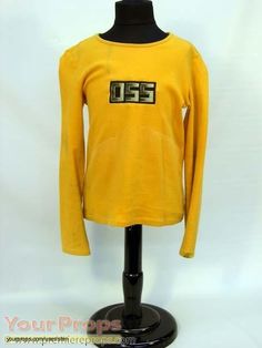 a mannequin wearing a yellow shirt with the number twenty five on it