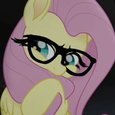 a close up of a pony with glasses on