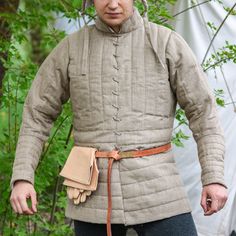 🌿💪 Crafted in the heart of Europe! Natural materials! Introducing our Catalan Knight's Gambeson, a masterpiece of medieval attire that encapsulates the essence of chivalry and tradition. Crafted with meticulous attention to detail, this gambeson serves as an essential component of every knight's wardrobe. 🛒 Visit our shop on Etsy: https://www.etsy.com/pl/shop/SPESMedievalMarket  📝 Key Features  ◾ Authentic Catalan design inspired by 14th-century altar painting. ◾ Premium linen construction f Medieval Outerwear For Larp With Historical Design, Medieval Style Outerwear With Historical Design For Costume, Medieval Style Outerwear For Costume With Historical Design, Medieval Style Historical Outerwear Costume, Medieval Style Historical Design Costume Outerwear, Historical Design Outerwear For Medieval Festivals, Medieval Festival Costume Outerwear With Historical Design, Medieval Style Outerwear For Larp And Medieval Festivals, Medieval Style Outerwear For Larp And Festivals