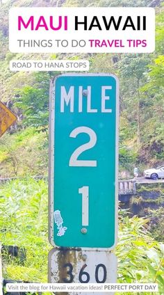 there is a blue sign that says mile 2 on the side of a road in hawaii