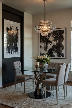 a dining room table with chairs and a chandelier