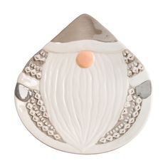 a white ceramic santa clause ornament with silver trimmings and an orange nose