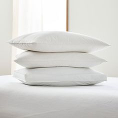 three pillows stacked on top of each other