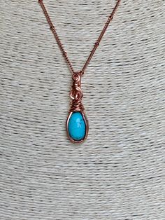 Turquoise and copper is such a beautiful combination, each color enhancing the other. This small, but boldly colored pendant shows off the copper/turquoise combo perfectly. This 10x14 natural turquoise oval cabochon is hand wrapped with bare copper wire. The pendant measures 1 3/8 inches in length (top of bail to bottom) and nearly 1/2 inch in width at the widest point of the pendant. Base wire is 20 gauge square wire and the smaller wrapping wire is 22 gauge half round wire. The pendant comes w Wire Wrapped Turquoise, Hawaii Jewelry, Wire Wrapped Jewelry Diy, Mermaid Glass, 3d Jewelry, Selling Handmade Items, Crystals Jewelry, Wire Jewelry Designs, Diffuser Jewelry