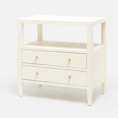 a white nightstand with two drawers on each side