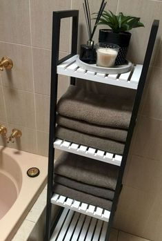 a bathroom with a sink, towel rack and bathtub