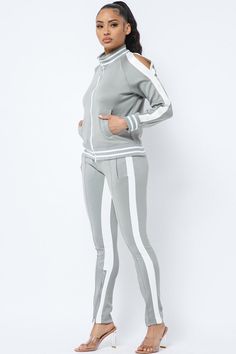 Elevate your activewear game with our Stripe Pants Track Suit with Double Side Zipper—a perfect blend of style, comfort, and functionality. Whether you’re heading to the gym, lounging at home, or running errands, this tracksuit will keep you looking effortlessly chic. Key Features: Stylish Design: Featuring eye-catching stripes along the sides, this tracksuit adds a sporty touch to your wardrobe, making it suitable for various occasions. Convenient Double Side Zippers: The innovative double side Gray Fitted Athleisure Tracksuit, Fitted Gray Athleisure Tracksuit, Fitted White Tracksuit For Gym, Gray Stretch Tracksuit For Loungewear, White Tracksuit For Workout, White Tracksuit For Workout Sportswear, White Sportswear Tracksuit For Workout, White Workout Tracksuit, White Athleisure Tracksuit For Workout