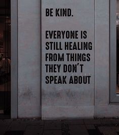 a sign on the side of a building that says, be kind everyone is still healing from things they don't speak about