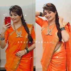 a woman in an orange sari taking a selfie