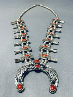 MAKE US AN OFFER BY CLICKING THE "MESSAGE SELLER" Button- This is an impressive vintage Navajo large coral silver squash blossom necklace. This remarkable necklace contains 14 outstanding coral silver squashes that each measure around 3/8". Located on each squash are stunning dome shaped coral stones that measure around 5/16" X 3/16". Surrounding the stones on the squashes are amazing teepee stampings. Resting at the bottom of the necklace is a superior double silver shank flattened rope naja pe Silver Squash Blossom Necklace, Squash Blossom Necklace, Coral Stone, Squash Blossom, Cameo Necklace, Vintage Navajo, American Indian, Native American Jewelry, Silver Leaf